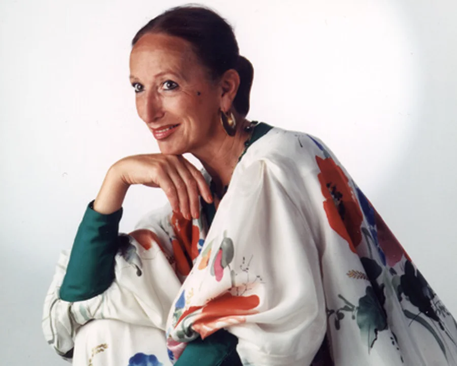 Ute Patel-Mißfeldt in a silk dress of her own design, printed with poppies and trimmed in green